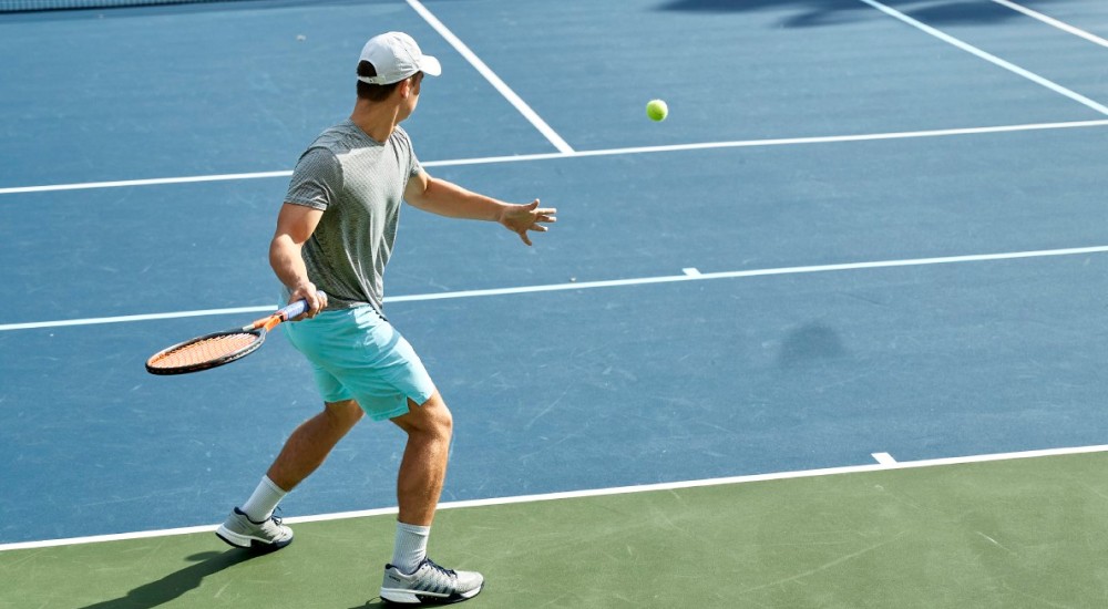 a tennis player hitting a tennis ball