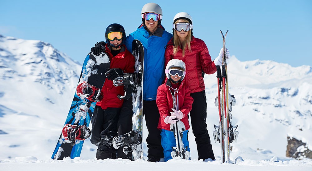 People skiing or snowboarding on a mountain