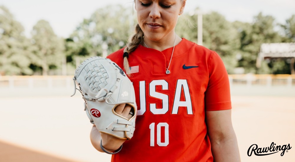 Fastpitch softball player wearing a Rawlings softball glove