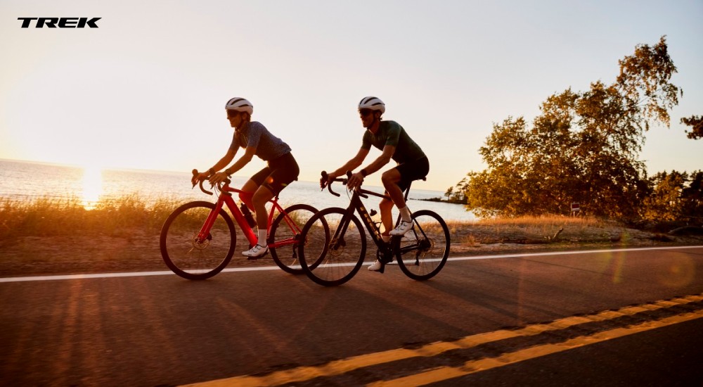 two men riding trek road bikes