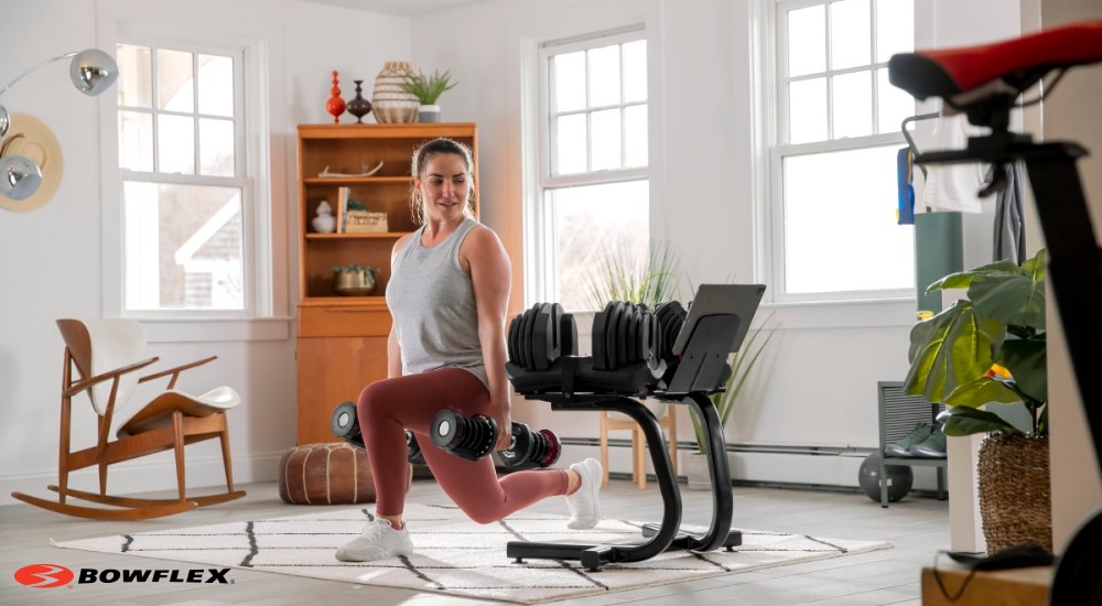 A woman working out in her home with weights