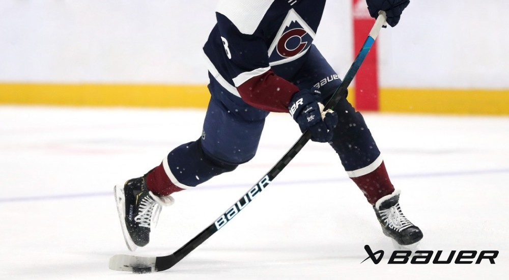 player using a hockey stick with flex