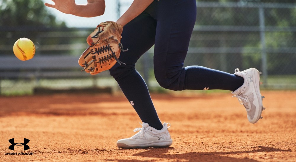 woman playing softball in softball cleats