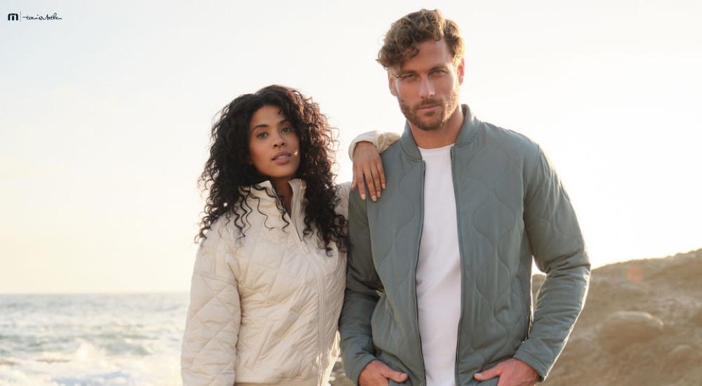 a man and a woman wearing athleisure clothing