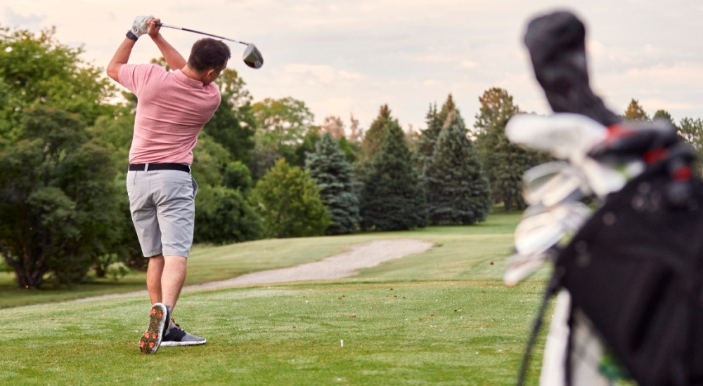 A scheels customer playing golf