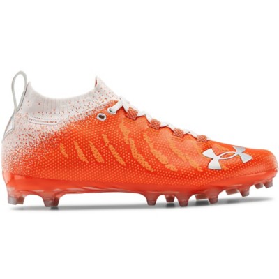 orange and white under armour football cleats