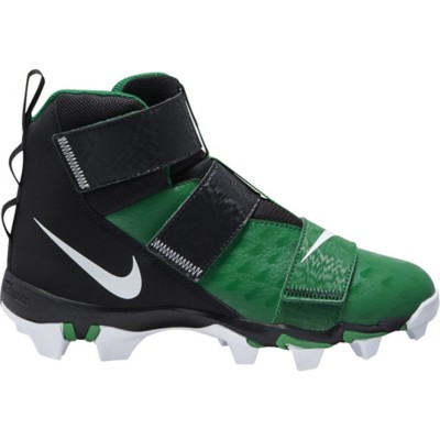 green and black football cleats