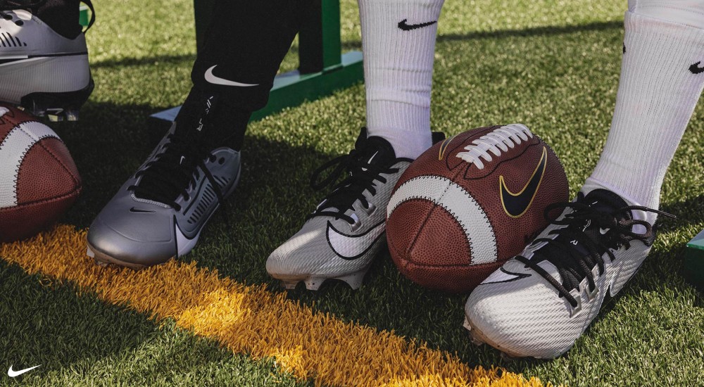 a football player wearing a pair of nike football cleats