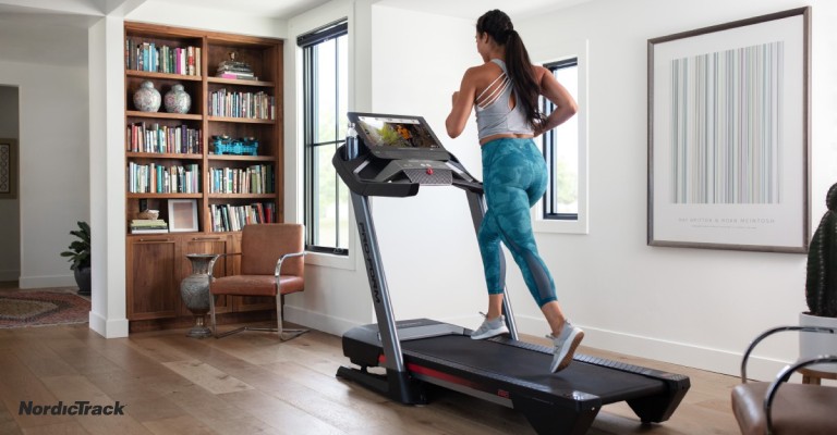 a women running on a treadmill in her home