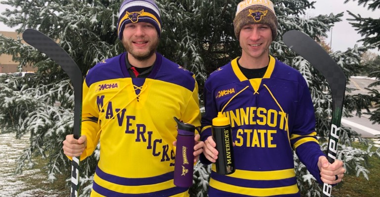 two guys in msu mavericks hockey jerseys