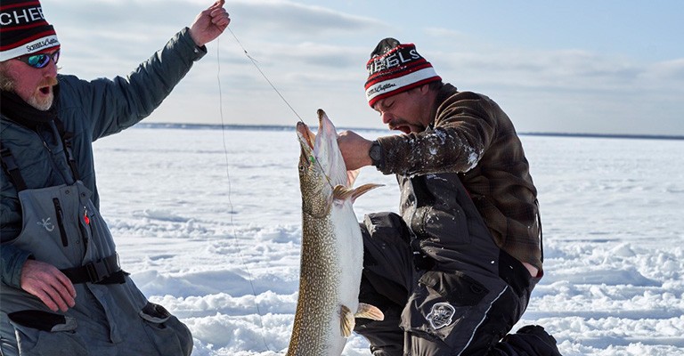 Reeling in a fish with a tip-up