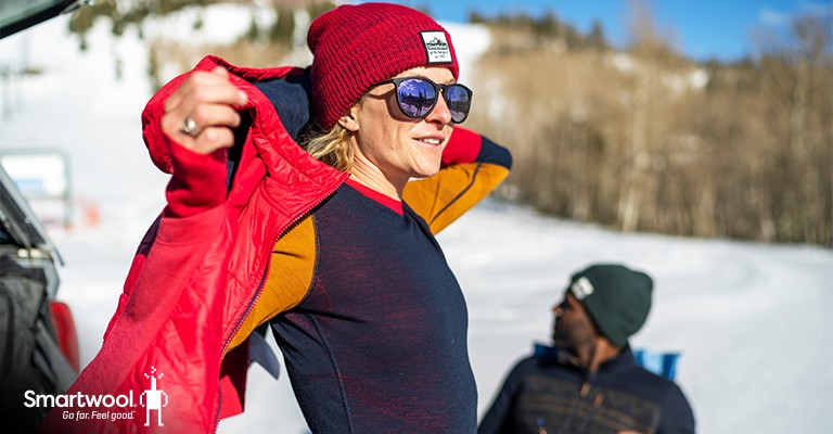 Woman showing a base layer goes under your jacket