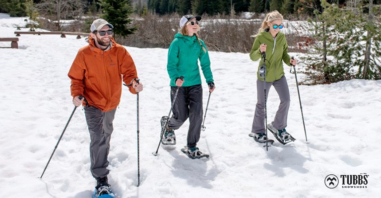 three people out snowshoeing together