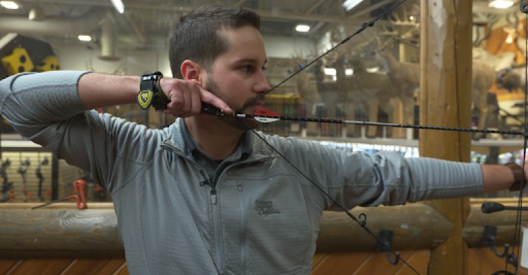 Archery expert Cass Edwards shooting a compound bow