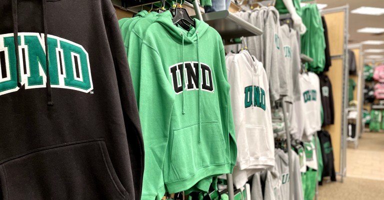 UND sweatshirts hanging on display