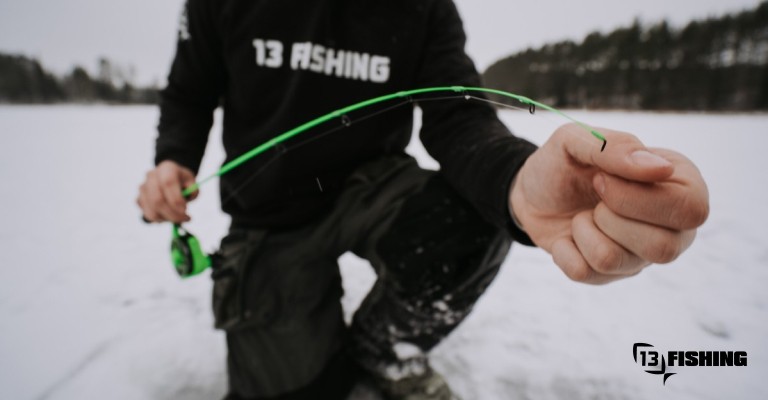 an angler holding an ice rod