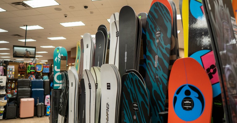 a variety of snowboards on display at sandy scheels