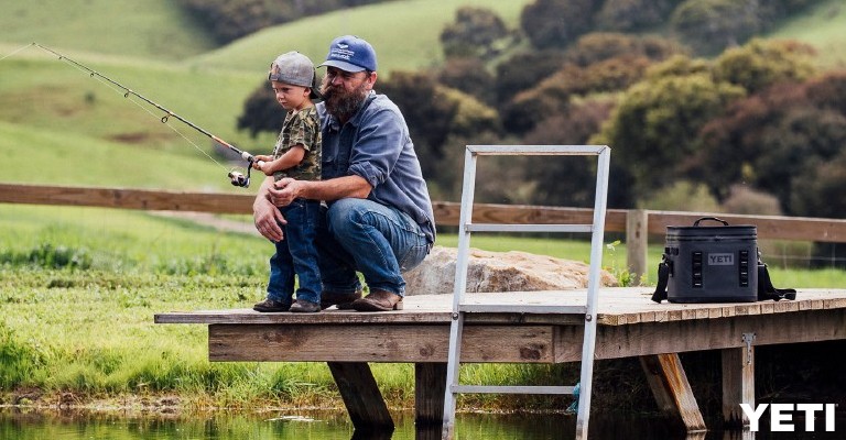 a dad fishing with his son