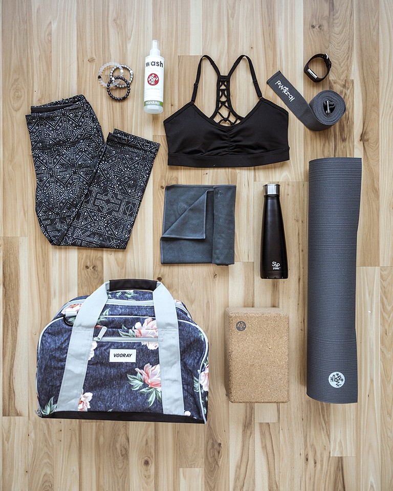 Image of a yoga accessories like a yoga mat and yoga towel