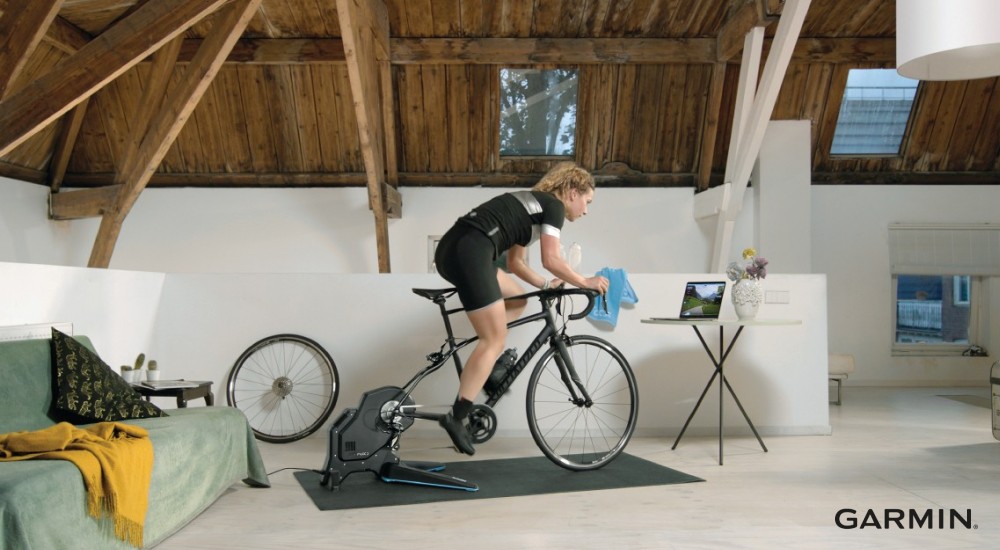 woman on a direct-drive indoor bike trainer