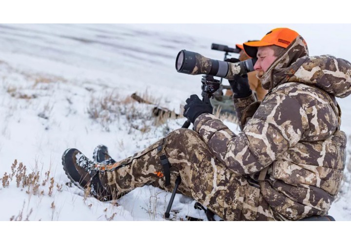 Hunter glassing from spotting scope 