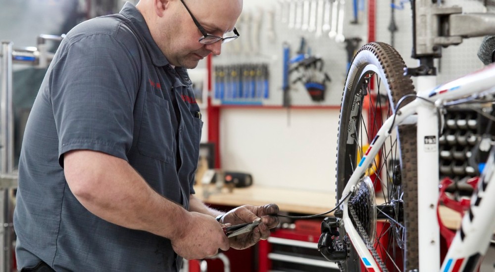 Service man working on a bike