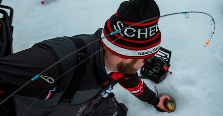 a fisherman using a fluorocarbon ice line
