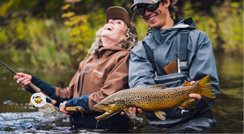 Beginners out fly fishing together with all the fly fishing essentials