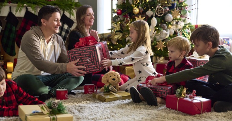 kids holding Christmas presents