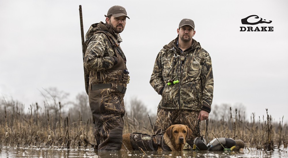 two duck hunters with duck hunting gear