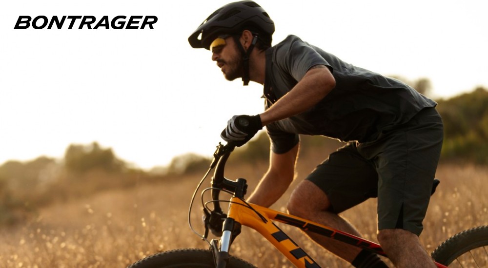 A man riding his bike on the trails