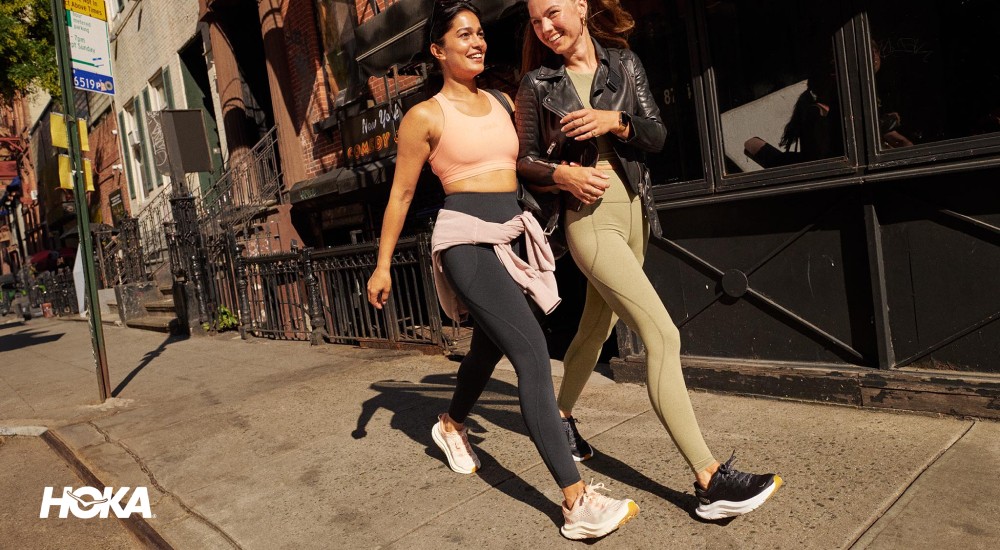 two women walking in nyc with hokas