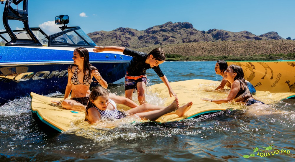 kids playing on an aqua lily pad