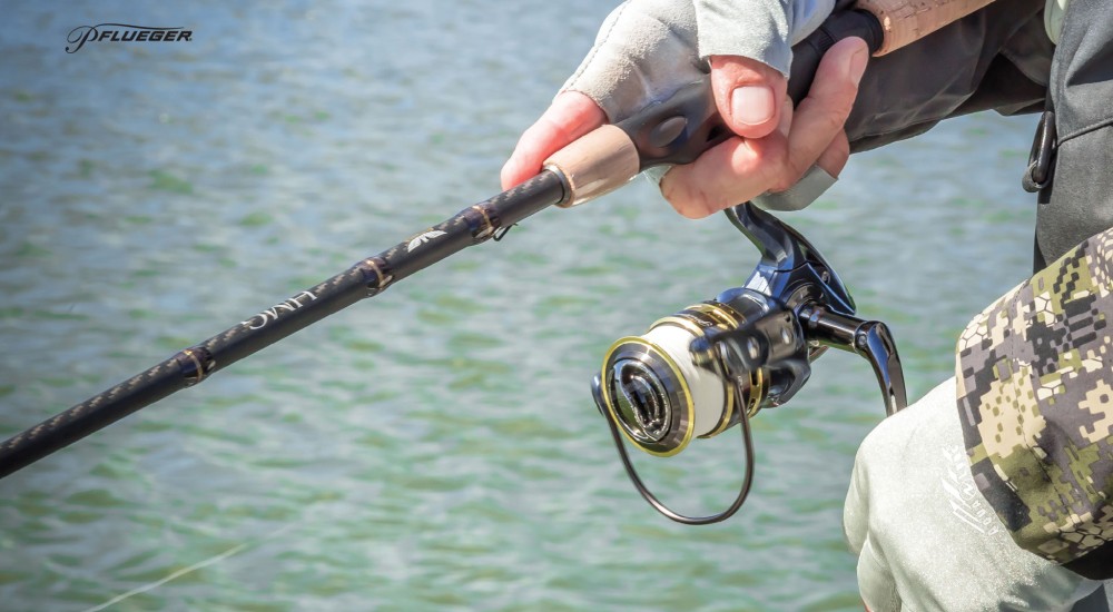 Fisherman casting a spinning reel rod