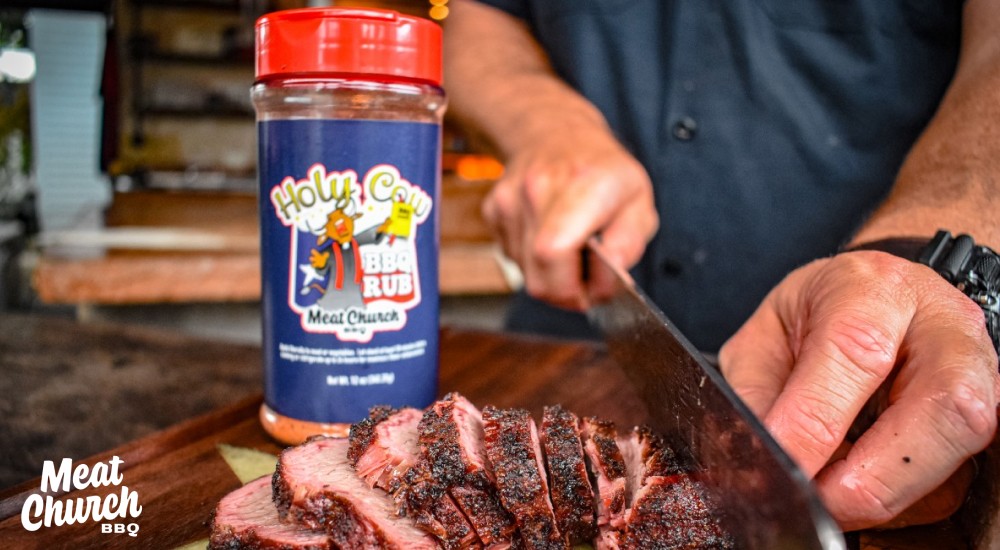 cutting up meat using Holy Cow BBQ rub