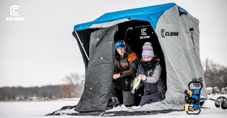 two kids fishing in an ice house