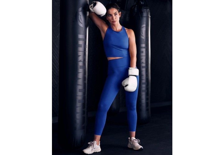 Lily Aldridge in boxing gloves wearing the Powerbeyond Leggings
