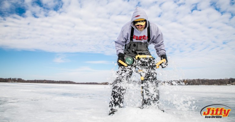 a man using a propane auger when ice fishing