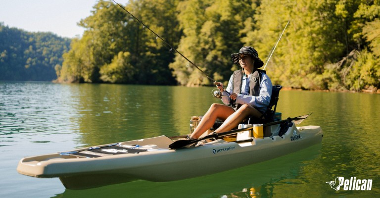 woman kayaking and fishing
