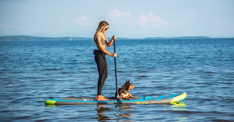 A girl on a stand up paddle board
