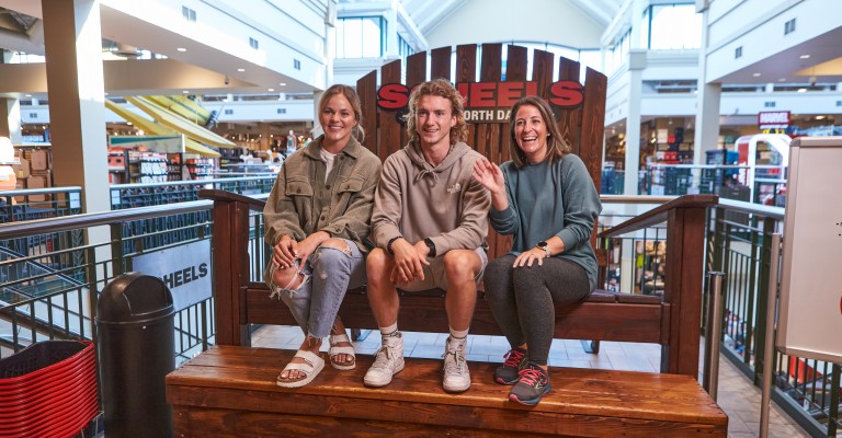 customers taking photo on the big fargo chair