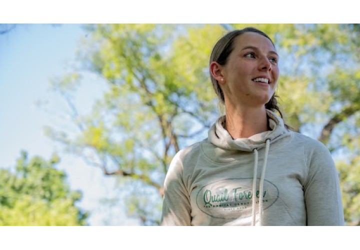 Woman wearing Quail Forever hooded sweatshirt