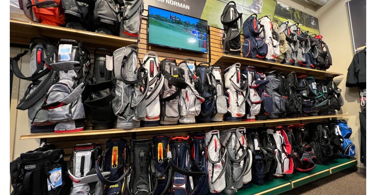 golf bags on display at a scheels golf shop