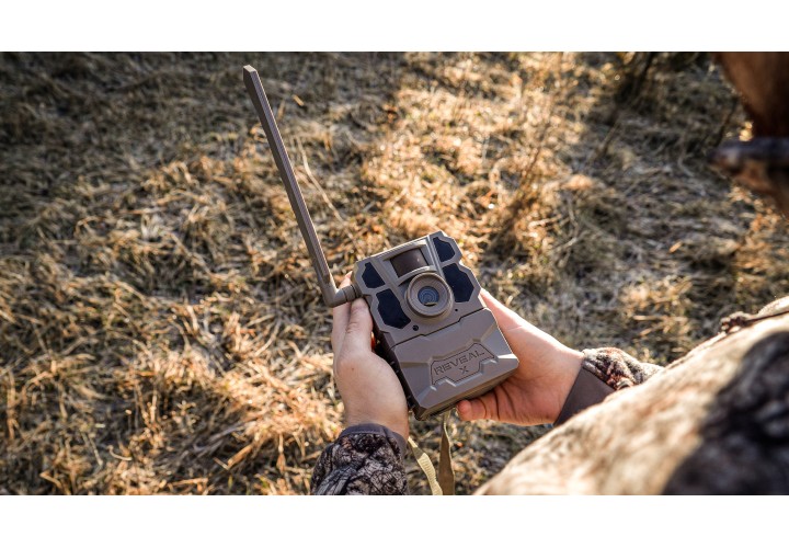 Hunter setting up Tactacam trail camera. 