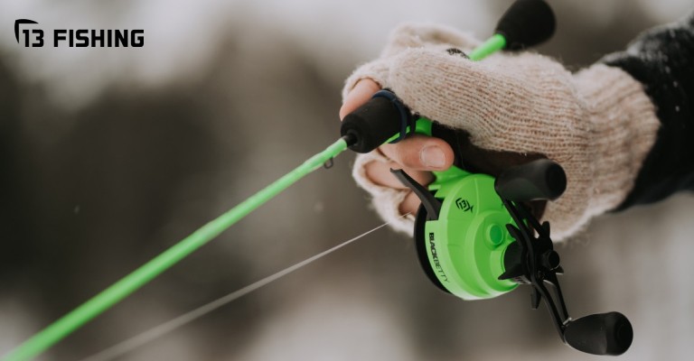 a ice rod and reel inline combo being held by fisherman