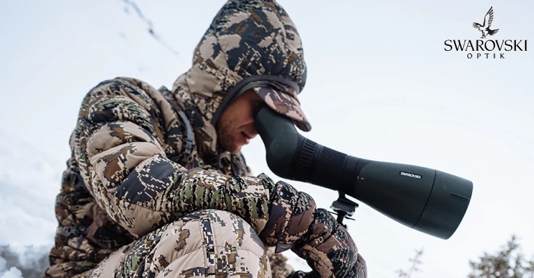 a hunter using a swarovski spotting scope