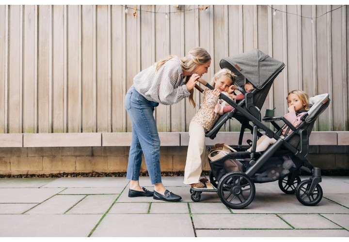 Women with 3 children on stroller