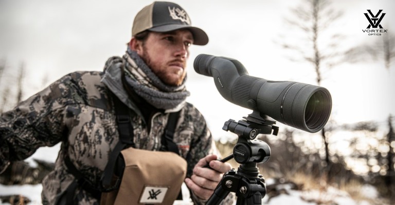 hunter using spotting scope