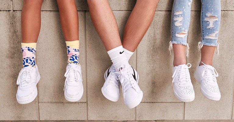 teens wearing all white sneakers