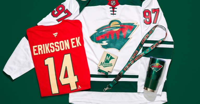 a bunch of minnesota wild gear on a green background